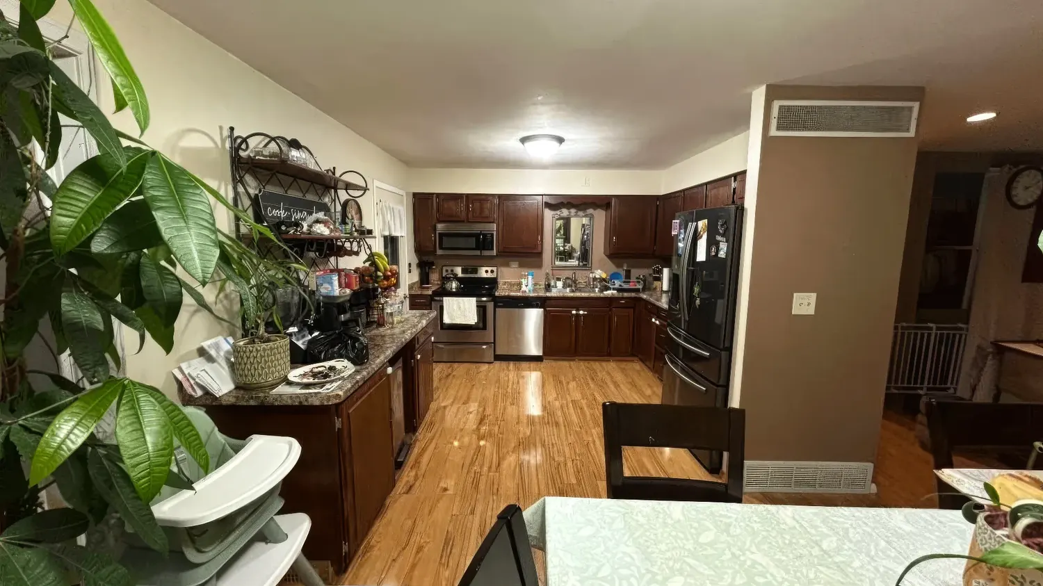 Kitchen before renovation — dark cherry cabinets